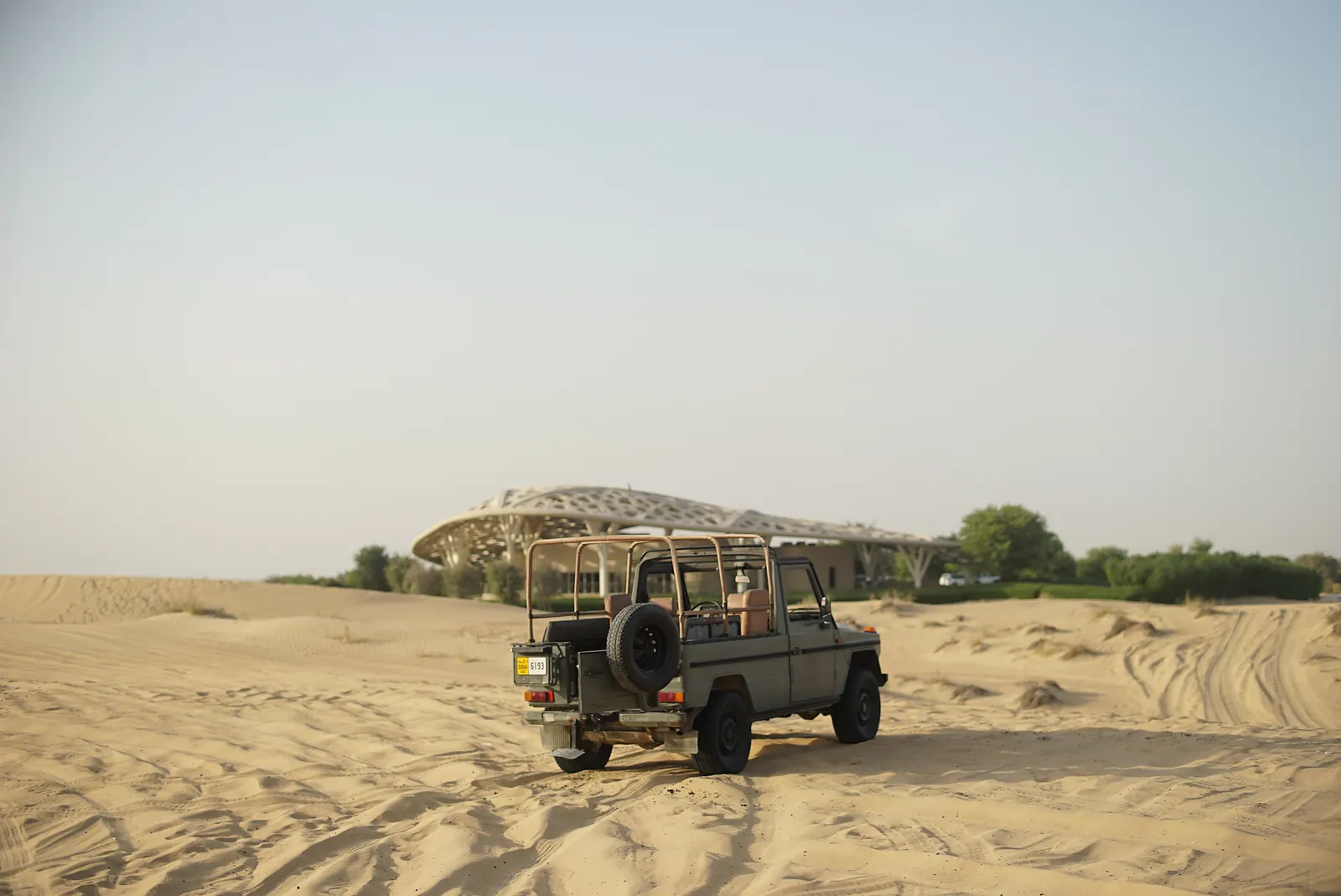 Expedition jeep crossing open desert sand on a Searching for Eden fruit-hunting trip