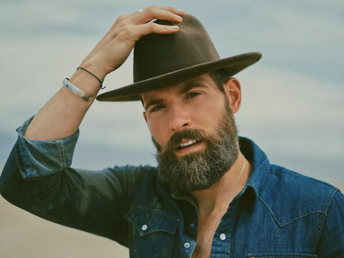 Portrait of Matthew Nadu, founder of Bring Back Eden, in a wide-brim hat