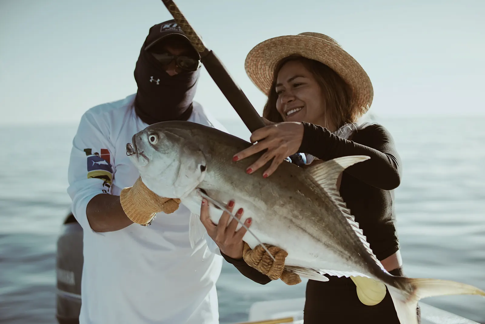 A fresh catch held up on a boat during a Searching for Eden expedition